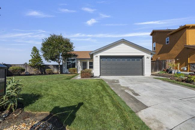 2240 Preston Court Hollister, CA 95023 - Photo 3 of 21 a front view of a house with a yard and garage
