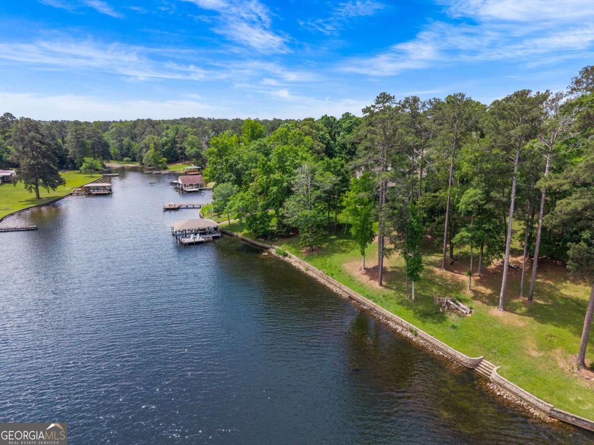151 Bill Johnson Road Northeast Milledgeville, GA 31061 - Photo 24 of 27 a view of a lake with a mountain