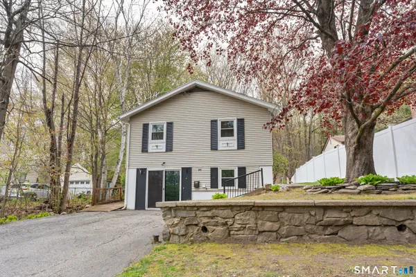 a house with trees in the background