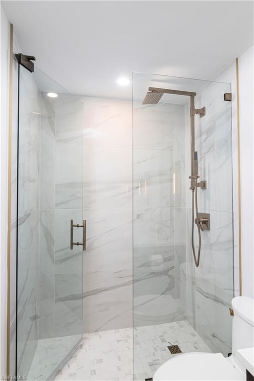 1222 Gordon Drive, Unit 4 Naples, FL 34102 - Photo 13 of 20 a bathroom with a shower