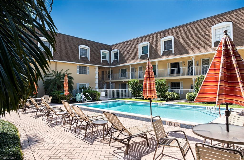 1222 Gordon Drive, Unit 4 Naples, FL 34102 - Photo 18 of 20 a building view with a outdoor space