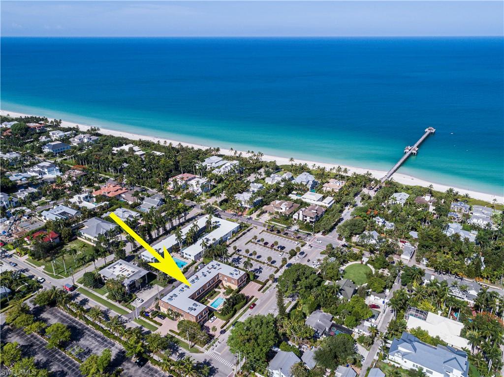 1222 Gordon Drive, Unit 4 Naples, FL 34102 - Photo 2 of 20 a city view with tall buildings