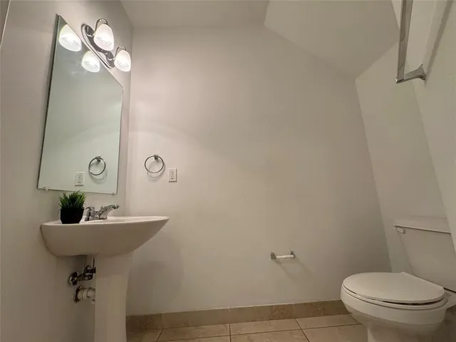 a kitchen with stainless steel appliances granite countertop a sink and a refrigerator