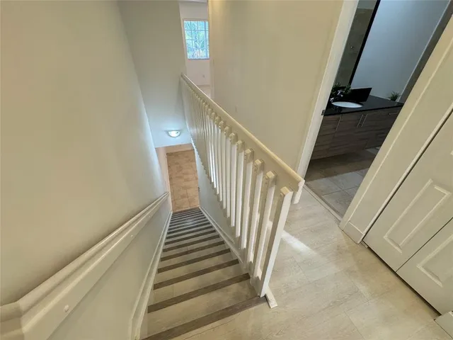 a view of hallway with wooden floor