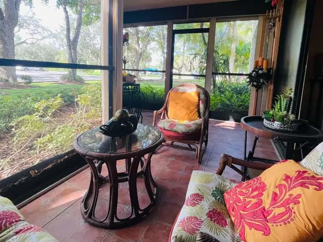 a outdoor living space with furniture and a potted plant