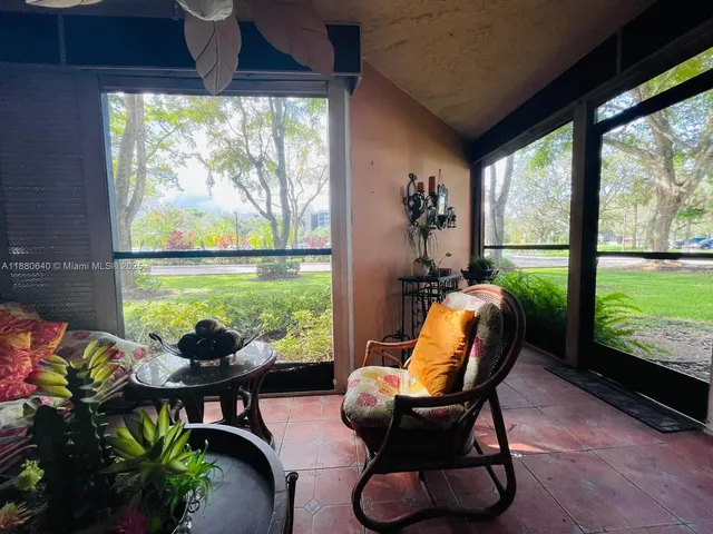 a view of a yard with car parked