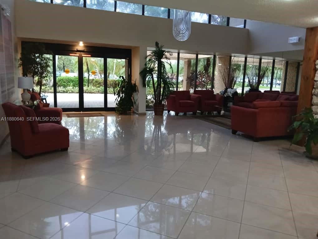 16325 Golf Club Road, Unit 102 Weston, FL 33326 - Photo 18 of 21 a living room with furniture and a large window