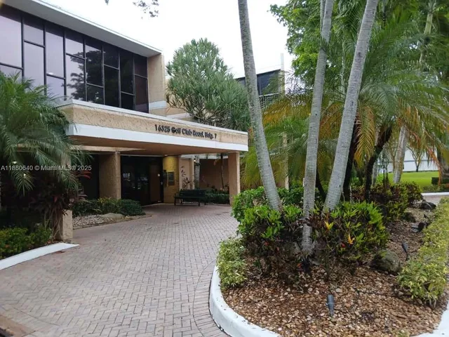 a view of a lake with a yard