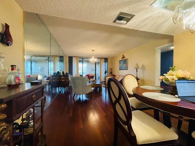 a living room with furniture and a lamp