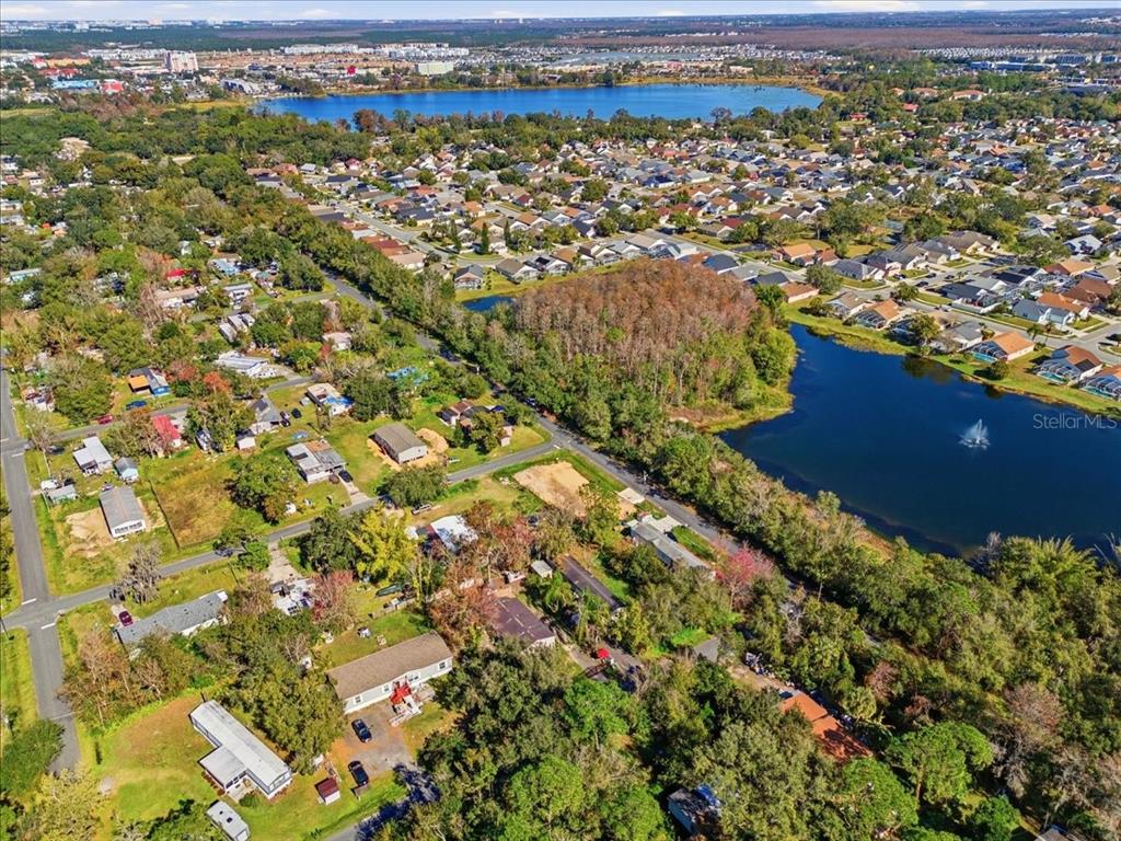 0 Howison Road Kissimmee, FL 34746 - Photo 7 of 14 an aerial view of residential houses with outdoor space and trees