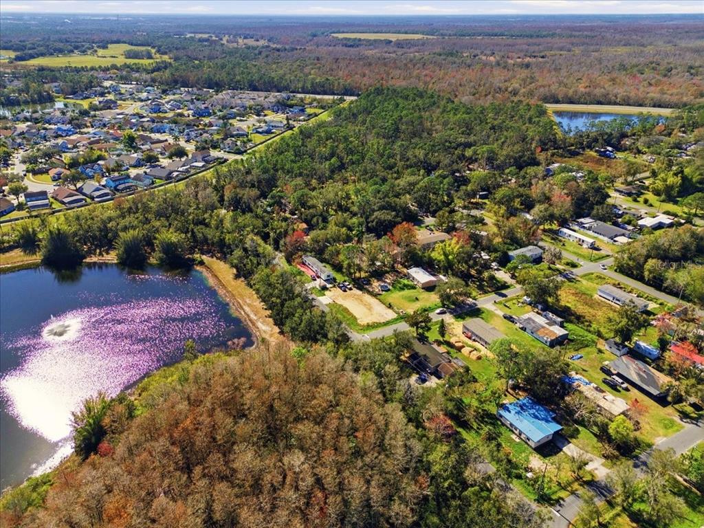 0 Howison Road Kissimmee, FL 34746 - Photo 8 of 14 an aerial view of residential houses with outdoor space and trees