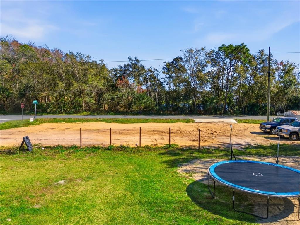 0 Howison Road Kissimmee, FL 34746 - Photo 10 of 14 a view of a swimming pool with a yard