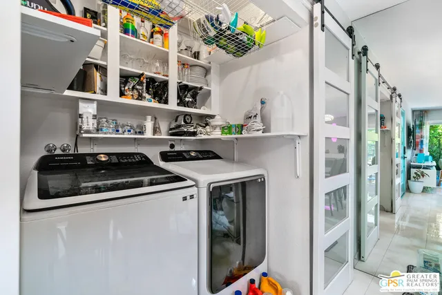 a kitchen with stainless steel appliances kitchen island granite countertop a sink and cabinets