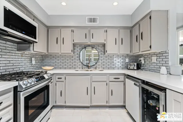 a kitchen with a stove and a microwave