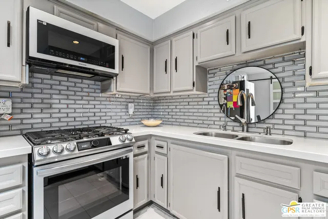a kitchen with a table and chairs in it
