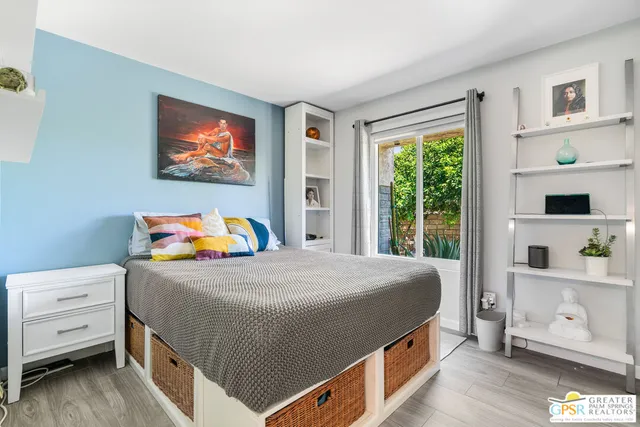 a bedroom with a bed and a cabinets