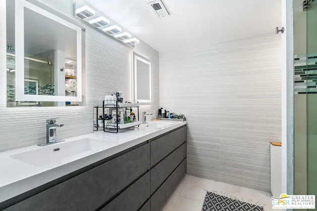 a view of backyard with seating area and green space