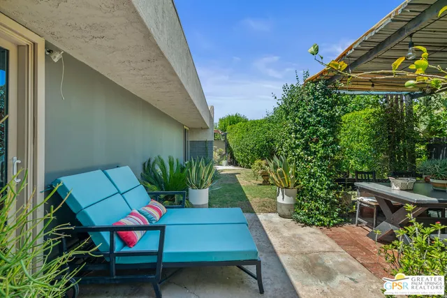 a backyard of a house with seating space