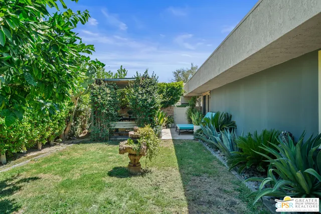 a view of a chairs and table in the patio