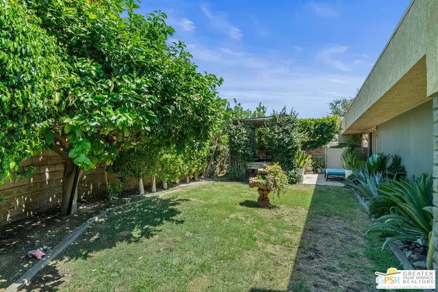a view of a chairs and table in patio