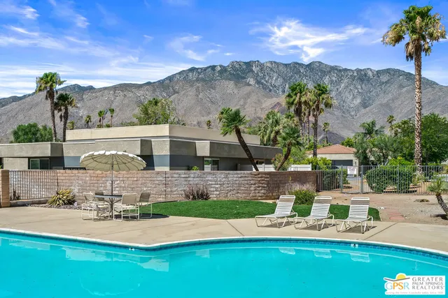a view of a swimming pool with a patio