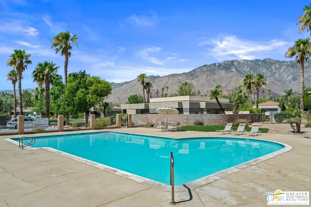 a view of a tree in front of a house