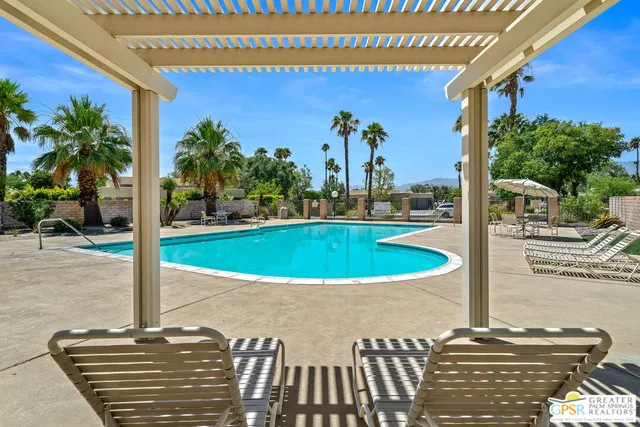 a view of a large yard with a large tree