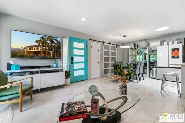 a dining room with furniture and window