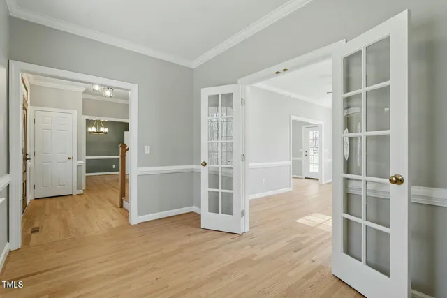 a kitchen with stainless steel appliances granite countertop a sink a stove and a wooden floors