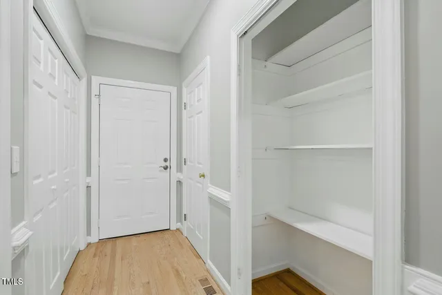 a bathroom with double vanity sink and a mirror