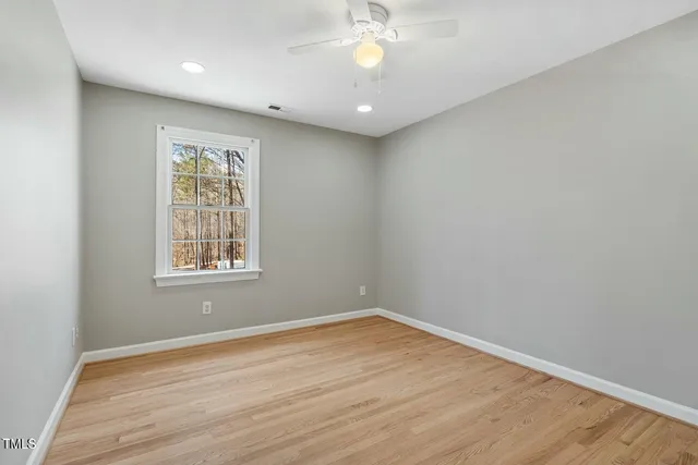 a view of kitchen with wooden floor and electronic appliances