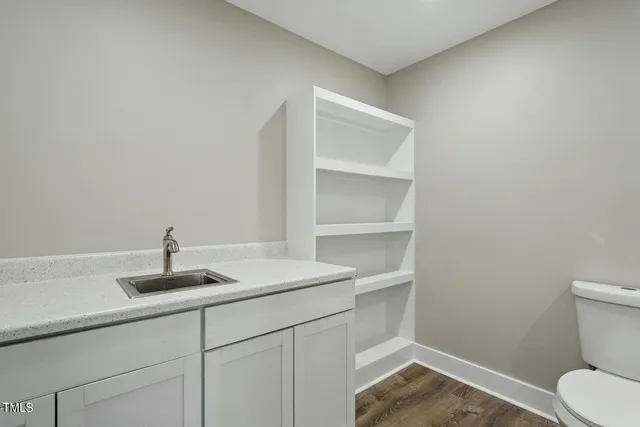 a bathroom with a sink a toilet