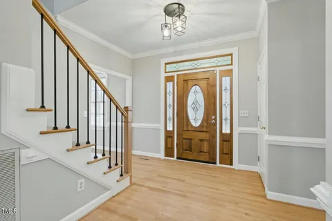 a view of an entryway with wooden floor