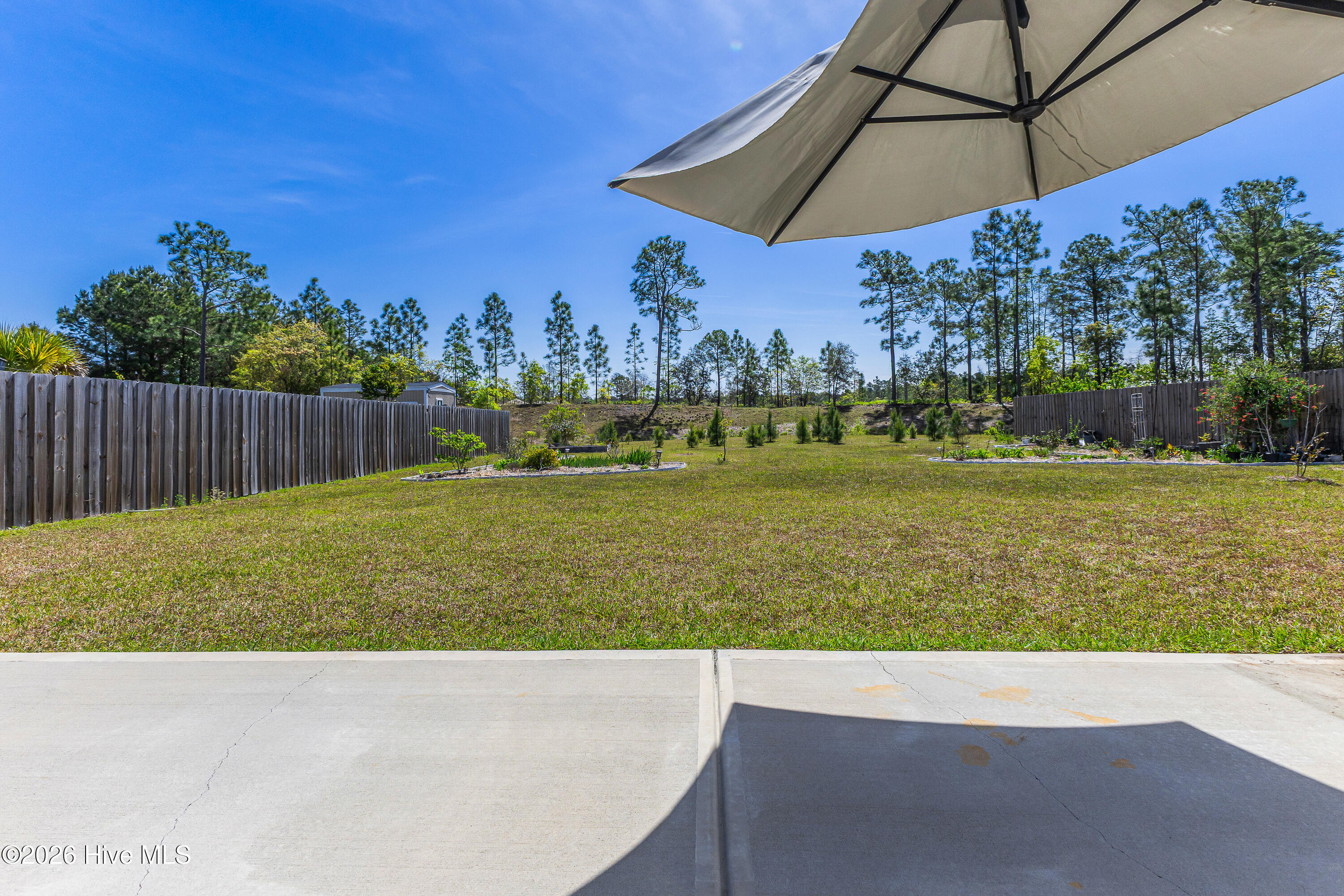1038 Burled Oak Ridge Loop Southeast Bolivia, NC 28422 - Photo 45 of 63 Extra patio great for grilling or soaking up the North Carolina Sun