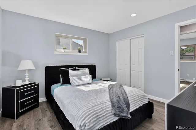 a bedroom with a bed and a dresser