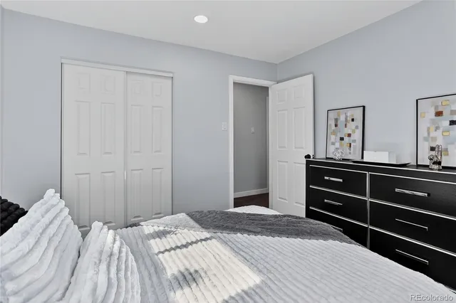 a bathroom with a toilet a sink and a mirror