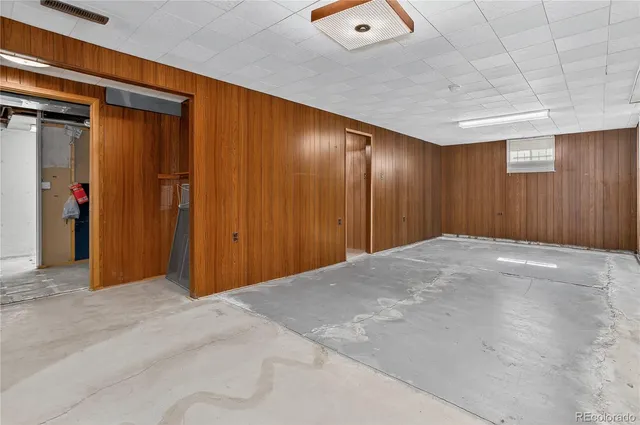 a view of an empty room with a wooden walls