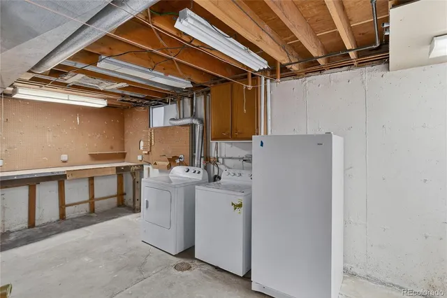 a utility room with cabinets