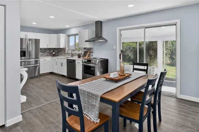 a living room with furniture and a kitchen island