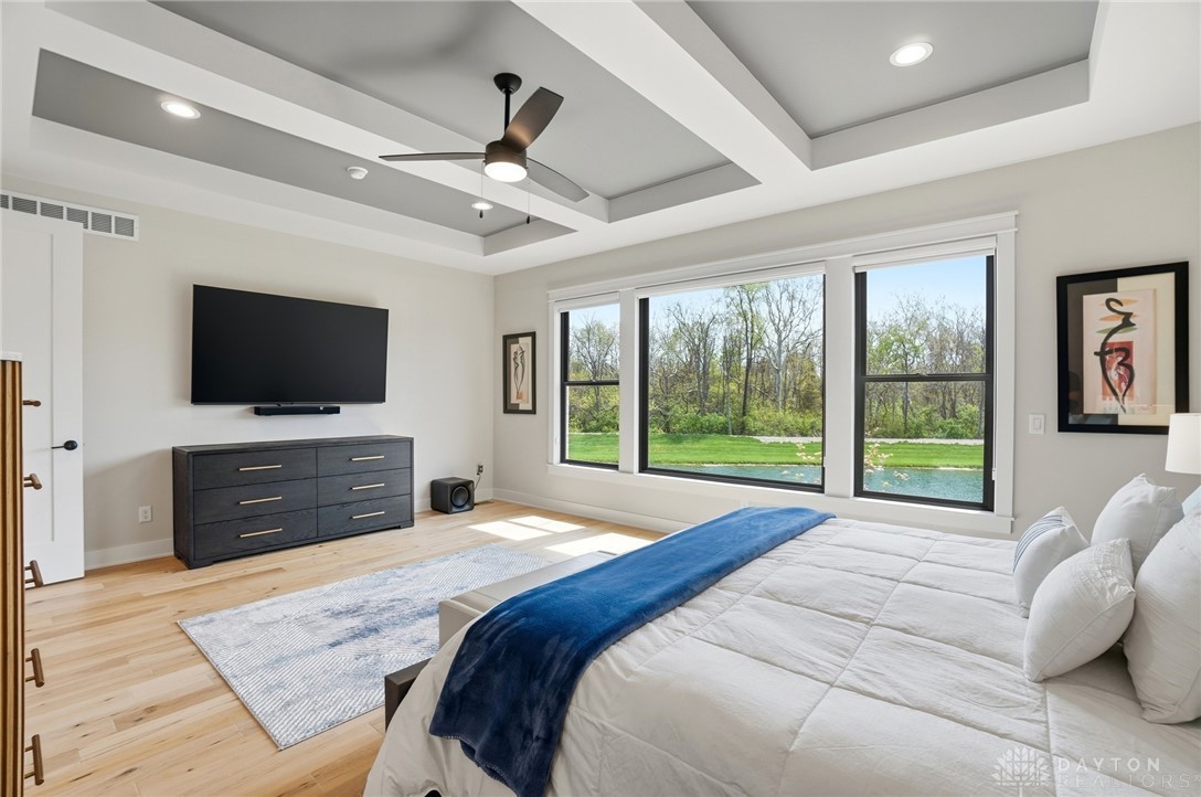 1247 Normandy Rue Dayton, OH 45458 - Photo 21 of 76 This spacious primary bedroom features expansive windows overlooking a serene landscape.