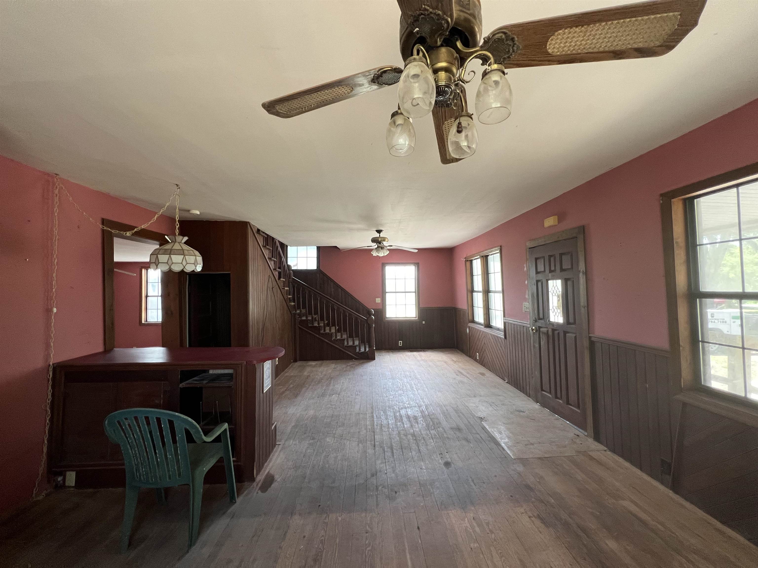 9680 Luther Beck Road Hastings, FL 32145 - Photo 12 of 24 a view of a livingroom with furniture a chandelier and wooden floor