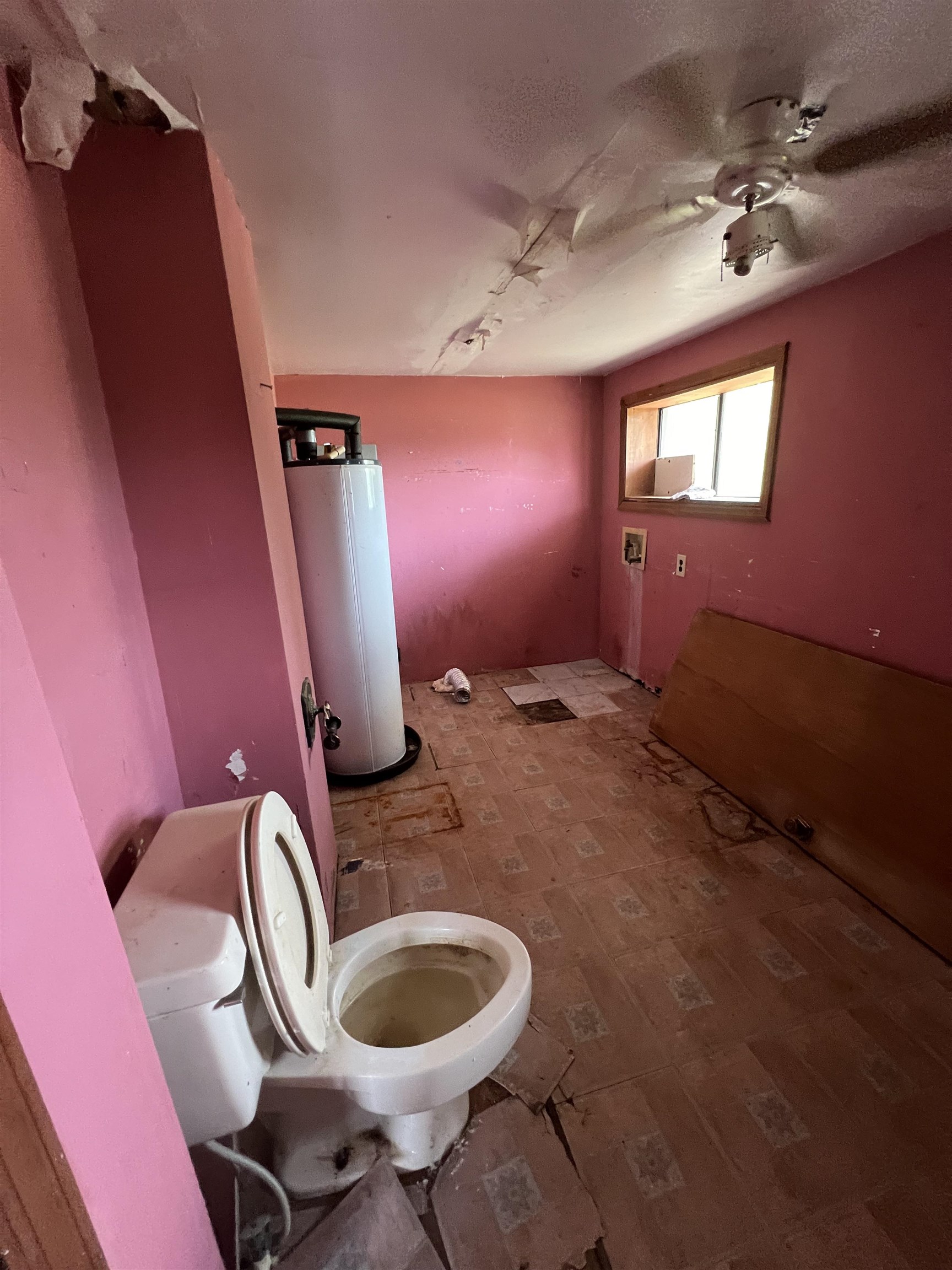 9680 Luther Beck Road Hastings, FL 32145 - Photo 17 of 24 a bathroom with a toilet a sink and mirror