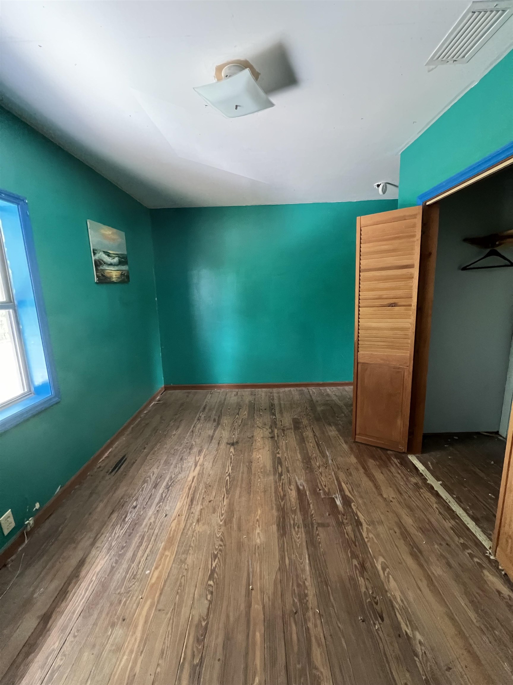 9680 Luther Beck Road Hastings, FL 32145 - Photo 22 of 24 a view of a room with wooden floor