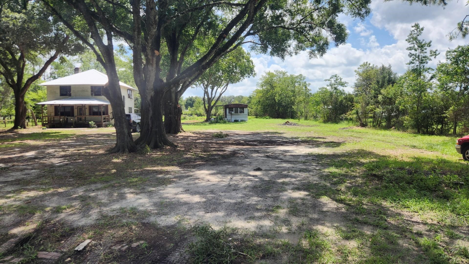 9680 Luther Beck Road Hastings, FL 32145 - Photo 3 of 24 a view of a yard with large trees