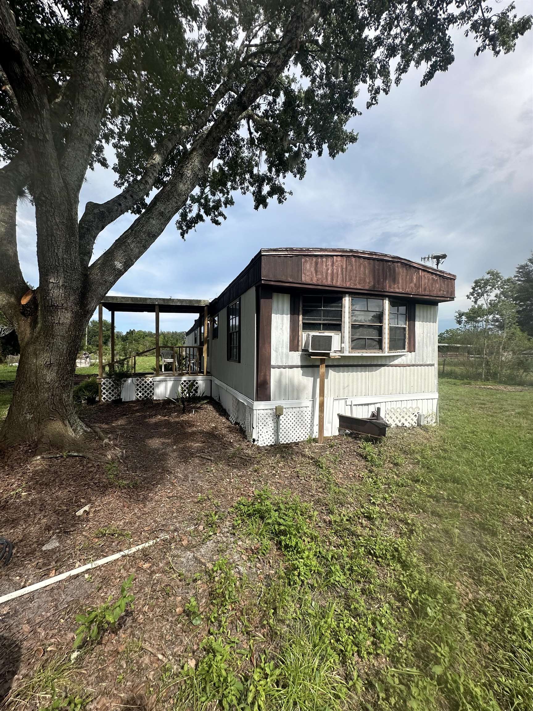 9680 Luther Beck Road Hastings, FL 32145 - Photo 4 of 24 a front view of a house with a yard