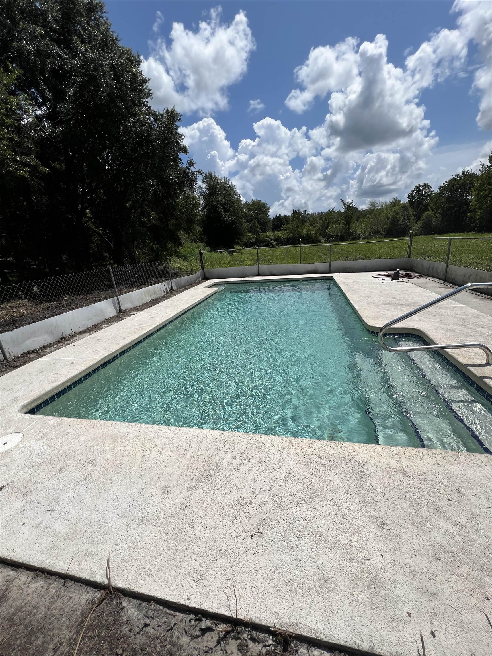 9680 Luther Beck Road Hastings, FL 32145 - Photo 7 of 24 a view of a swimming pool and a yard
