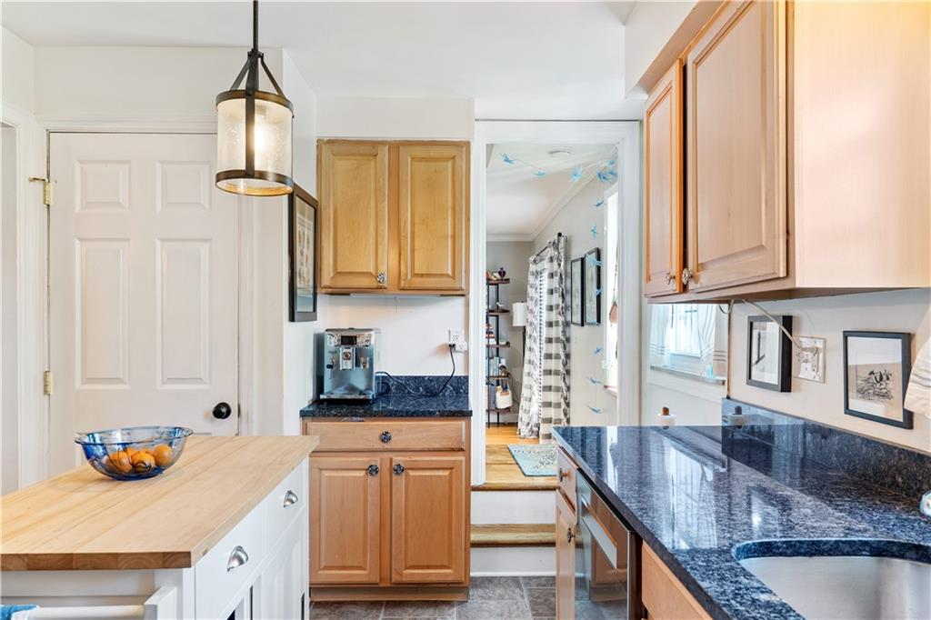 552 Audubon Avenue Pittsburgh, PA 15228 - Photo 13 of 30 a kitchen with stainless steel appliances granite countertop a sink stove and refrigerator