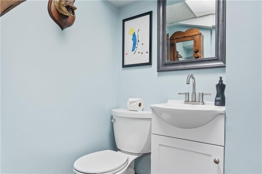 552 Audubon Avenue Pittsburgh, PA 15228 - Photo 21 of 30 a bathroom with a toilet sink and mirror