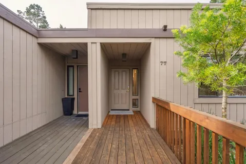 a view of a wooden door of the house