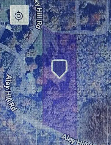 a brick building with a bench in it